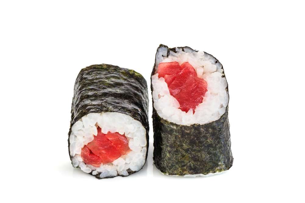 Simple maki sushi, two rolls isolated on white. Just nori, rice and tuna