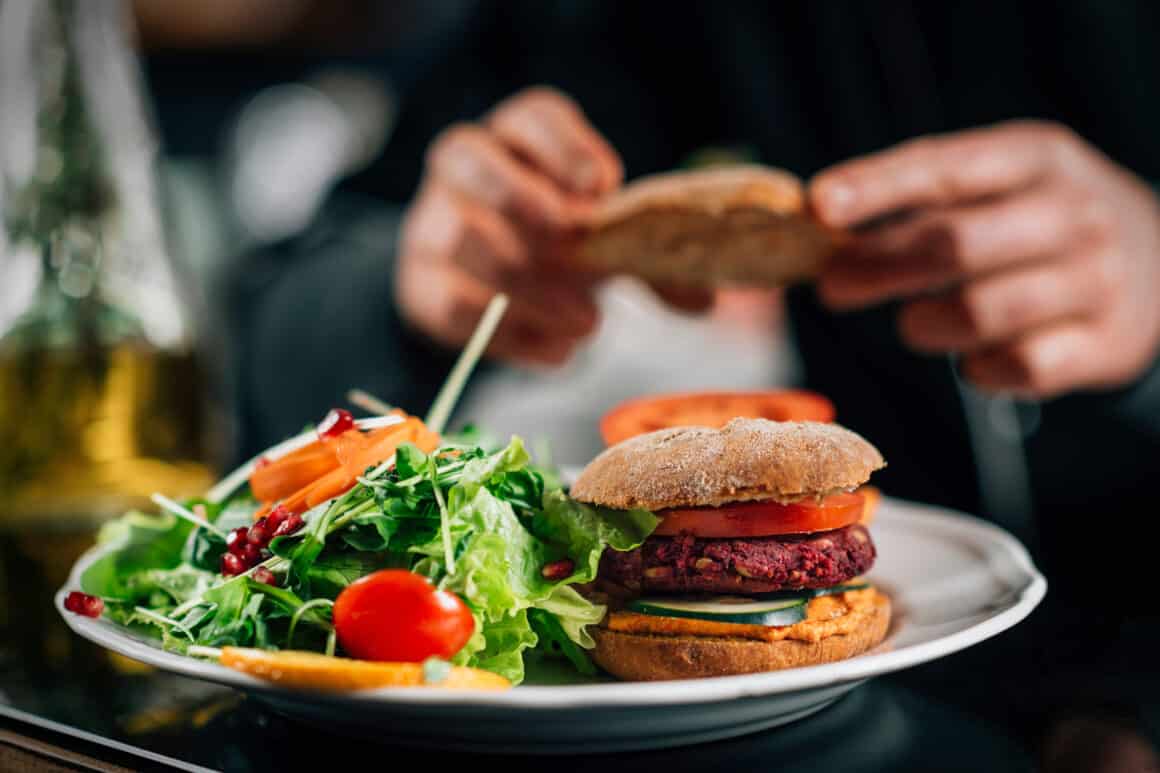 Chef making healthy vegetarian burgers, close up.