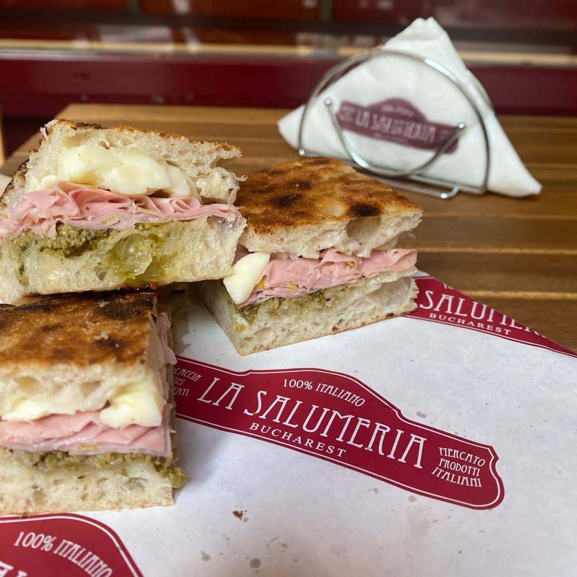 panini cu foccacia cu mortadella, branza si verdeata de la Salumeria. Panini București